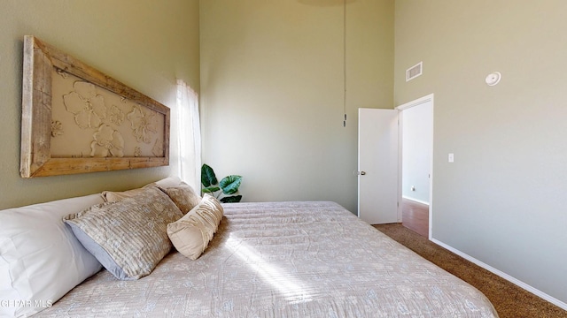684 Abington Dr, El Paso, TX 79912 - carpeted bedroom with a towering ceiling and baseboards