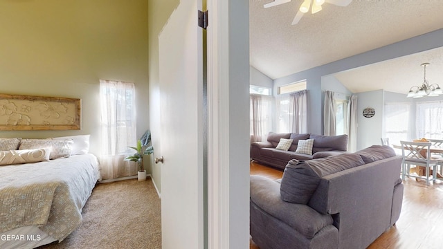 684 Abington Dr, El Paso, TX 79912 - living room featuring lofted ceiling, a chandelier, a ceiling fan, and a textured ceiling