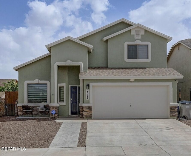 7044 Eagle Nest Ct, El Paso, TX 79934 - view of front of home featuring stucco siding, driveway, stone siding, and a garage