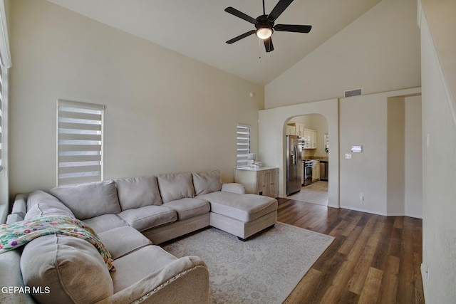 7044 Eagle Nest Ct, El Paso, TX 79934 - living room featuring a ceiling fan, high vaulted ceiling, arched walkways, and wood finished floors