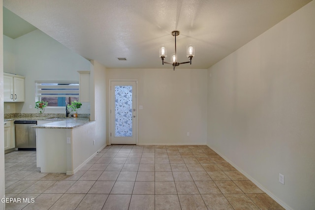 7044 Eagle Nest Ct, El Paso, TX 79934 - unfurnished dining area with light tile patterned flooring, a sink, baseboards, and a chandelier