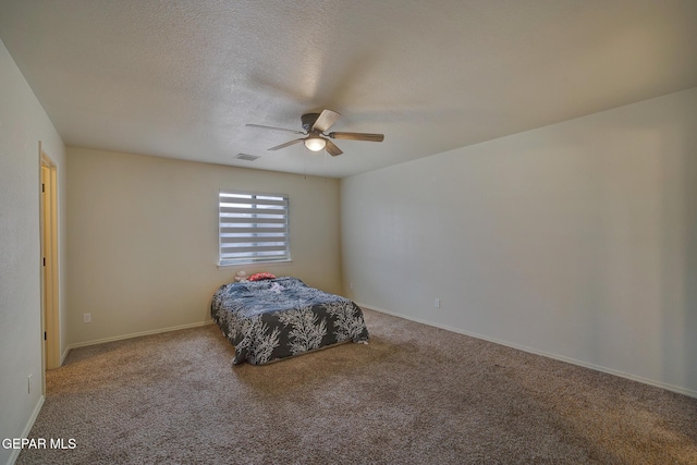 7044 Eagle Nest Ct, El Paso, TX 79934 - bedroom with carpet flooring, a ceiling fan, baseboards, and a textured ceiling
