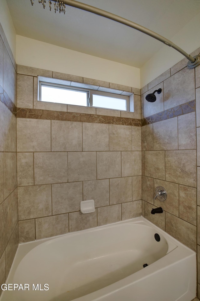 7044 Eagle Nest Ct, El Paso, TX 79934 - bathroom featuring healthy amount of natural light and shower / tub combination