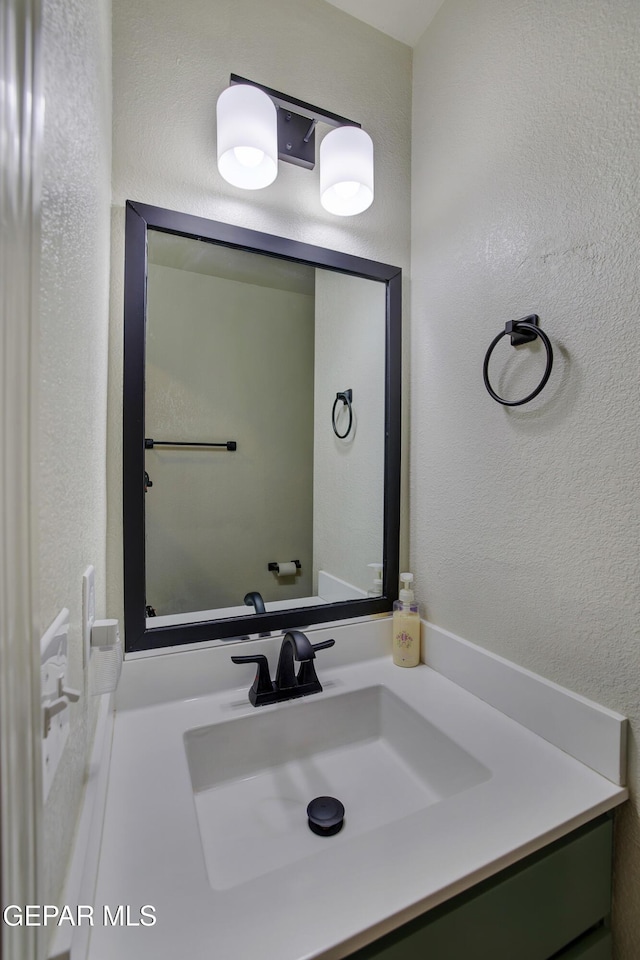 7044 Eagle Nest Ct, El Paso, TX 79934 - bathroom featuring vanity and a textured wall