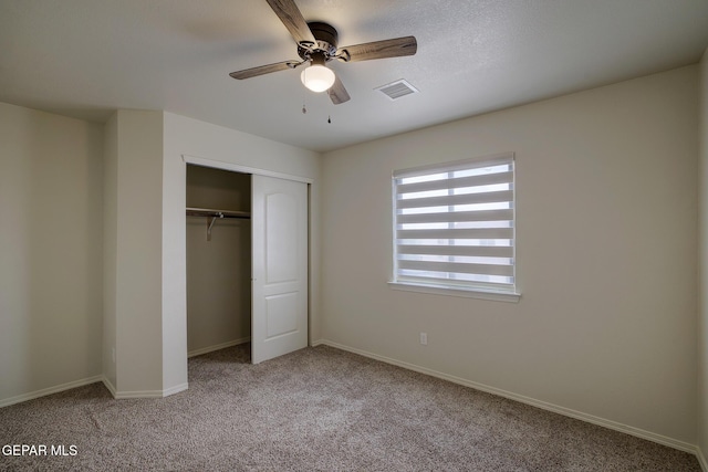 7044 Eagle Nest Ct, El Paso, TX 79934 - unfurnished bedroom featuring carpet floors, a closet, baseboards, and a ceiling fan