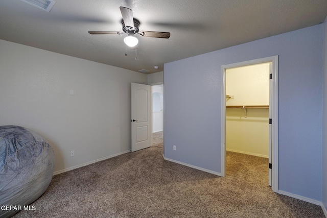 7044 Eagle Nest Ct, El Paso, TX 79934 - unfurnished bedroom with carpet, a spacious closet, and baseboards