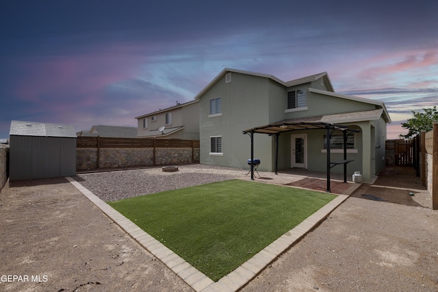 7044 Eagle Nest Ct, El Paso, TX 79934 - rear view of house with a patio area, an outdoor fire pit, and stucco siding