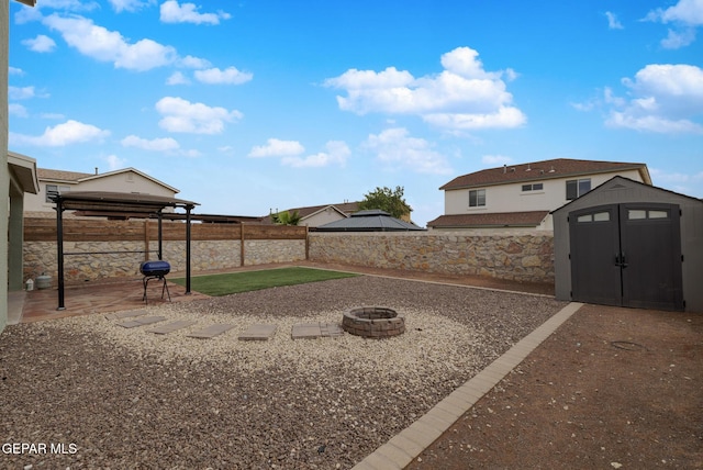 7044 Eagle Nest Ct, El Paso, TX 79934 - fenced backyard with a gazebo, an outdoor fire pit, and a patio area