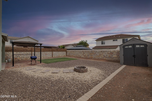 7044 Eagle Nest Ct, El Paso, TX 79934 - fenced backyard featuring a gazebo, a fire pit, and a patio area