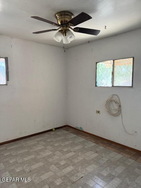 7901 Lirio Rd, El Paso, TX 79915 - unfurnished room featuring baseboards and a ceiling fan