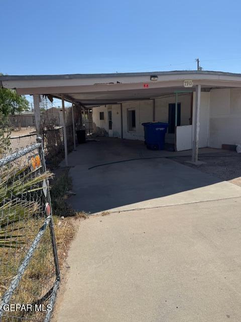 7901 Lirio Rd, El Paso, TX 79915 - view of front facade featuring a carport and concrete driveway
