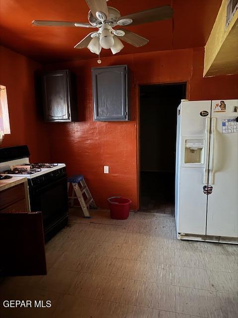 7901 Lirio Rd, El Paso, TX 79915 - kitchen featuring white refrigerator with ice dispenser, range with gas stovetop, ceiling fan, and light floors