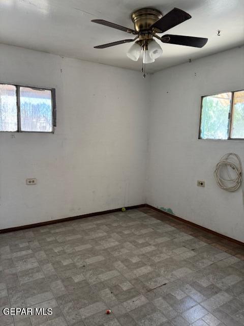 7901 Lirio Rd, El Paso, TX 79915 - empty room featuring a ceiling fan and baseboards