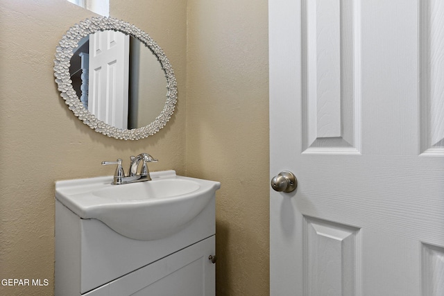 310 Kelvin Ave, El Paso, TX 79915 - bathroom with vanity and a textured wall