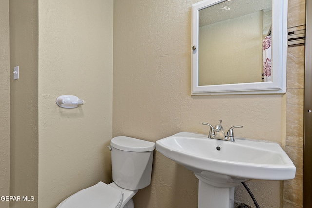 310 Kelvin Ave, El Paso, TX 79915 - bathroom with toilet and a sink