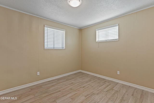 310 Kelvin Ave, El Paso, TX 79915 - unfurnished room with light wood-type flooring, plenty of natural light, and a textured ceiling