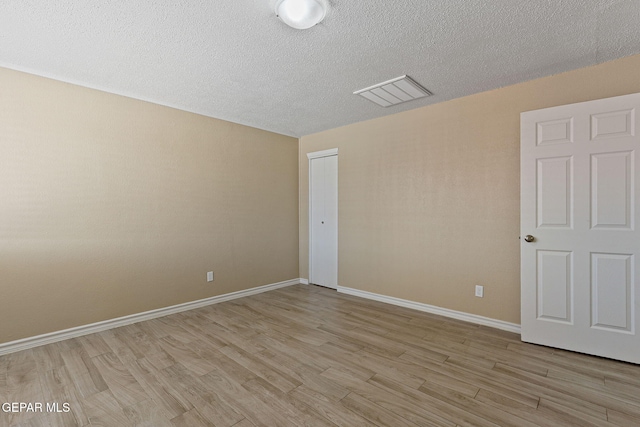 310 Kelvin Ave, El Paso, TX 79915 - spare room featuring light wood-style floors, a textured ceiling, and baseboards