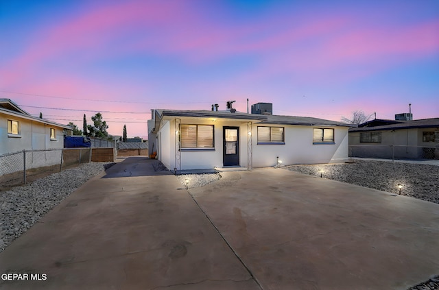 310 Kelvin Ave, El Paso, TX 79915 - view of front of home featuring stucco siding, cooling unit, and concrete driveway