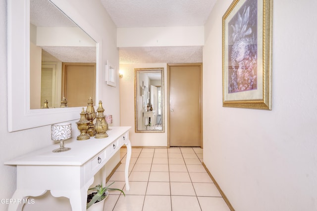 11625 Soberana Ln Unit A & B, El Paso, TX 79936 - hall with a textured ceiling, light tile patterned floors, and baseboards