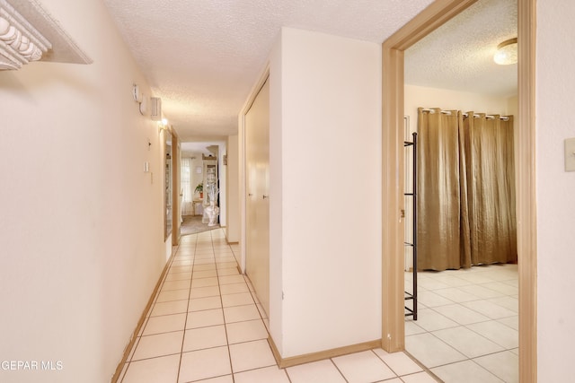 11625 Soberana Ln Unit A & B, El Paso, TX 79936 - corridor featuring a textured ceiling and light tile patterned floors