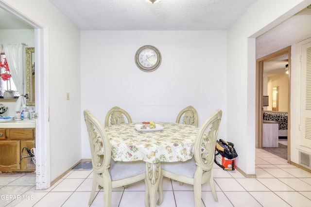 11625 Soberana Ln Unit A & B, El Paso, TX 79936 - dining space with light tile patterned floors and a textured ceiling