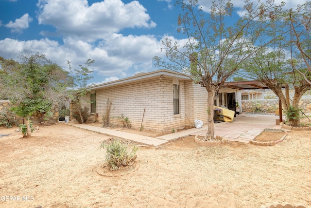 11625 Soberana Ln Unit A & B, El Paso, TX 79936 - view of side of property featuring a patio