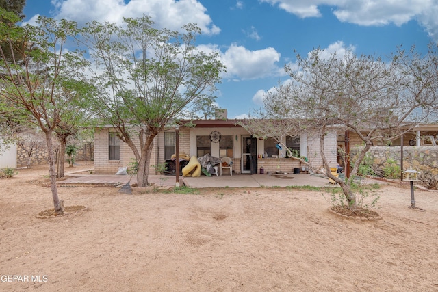 11625 Soberana Ln Unit A & B, El Paso, TX 79936 - rear view of house with a patio