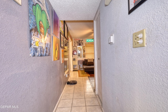11625 Soberana Ln Unit A & B, El Paso, TX 79936 - corridor featuring a textured wall, a textured ceiling, and light tile patterned floors