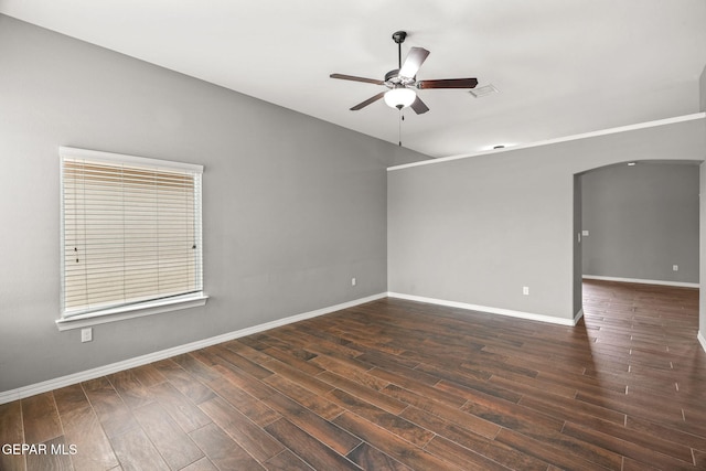 13519 Hazlewood St, El Paso, TX 79928 - spare room featuring ceiling fan, arched walkways, wood finished floors, and baseboards