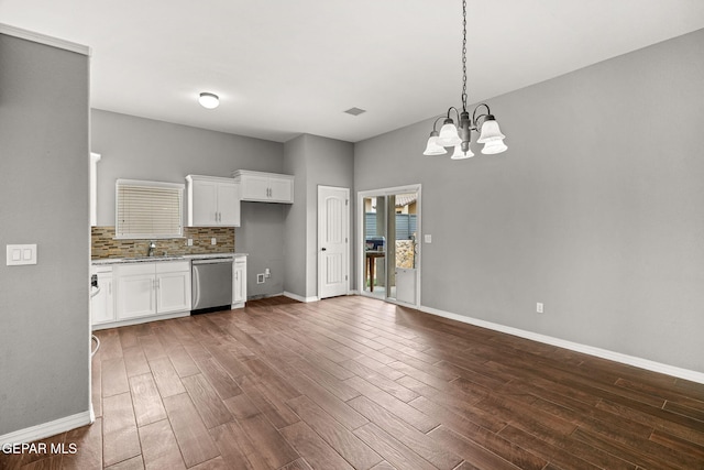 13519 Hazlewood St, El Paso, TX 79928 - kitchen featuring stainless steel dishwasher, a chandelier, light stone countertops, dark wood-style flooring, and white cabinetry