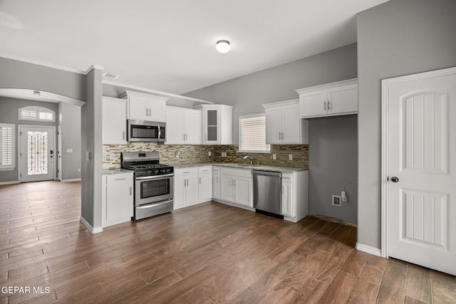 13519 Hazlewood St, El Paso, TX 79928 - kitchen featuring stainless steel appliances, backsplash, light stone countertops, and white cabinetry