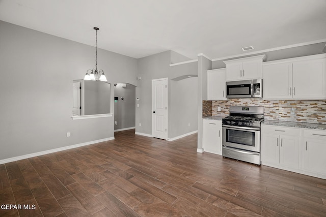 13519 Hazlewood St, El Paso, TX 79928 - kitchen with appliances with stainless steel finishes, tasteful backsplash, and dark wood-type flooring