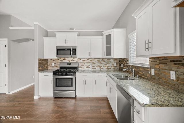 13519 Hazlewood St, El Paso, TX 79928 - kitchen with stainless steel appliances, a sink, light stone countertops, and white cabinets