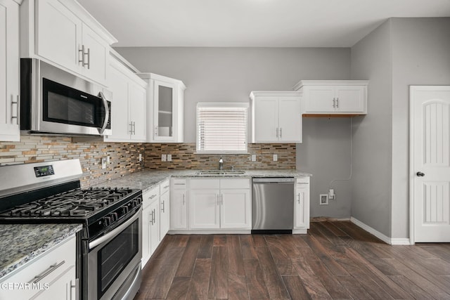 13519 Hazlewood St, El Paso, TX 79928 - kitchen with stainless steel appliances, a sink, light stone countertops, and white cabinetry