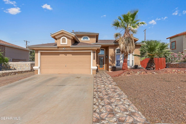 1328 Morgan Marie St, El Paso, TX 79936 - view of front of property with stucco siding, concrete driveway, and an attached garage