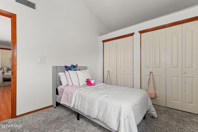 1328 Morgan Marie St, El Paso, TX 79936 - carpeted bedroom featuring multiple closets, vaulted ceiling, and baseboards