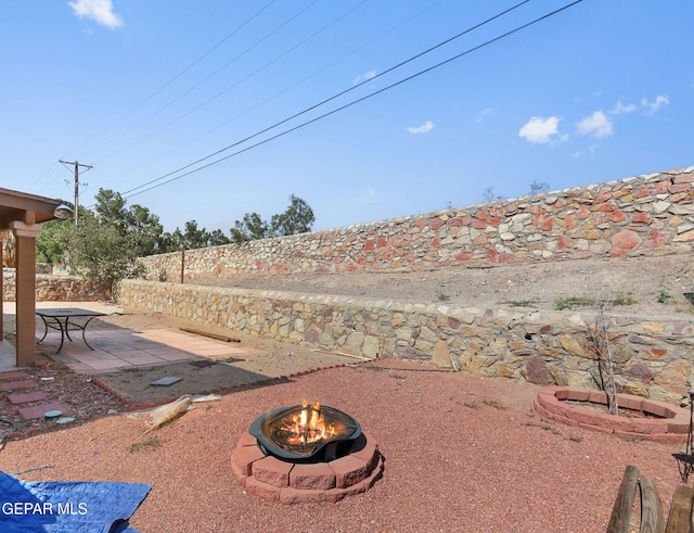 1328 Morgan Marie St, El Paso, TX 79936 - fenced backyard with a fire pit and a patio
