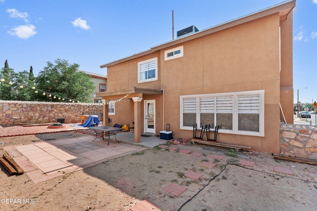 1328 Morgan Marie St, El Paso, TX 79936 - rear view of house featuring stucco siding, a patio area, and a fenced backyard