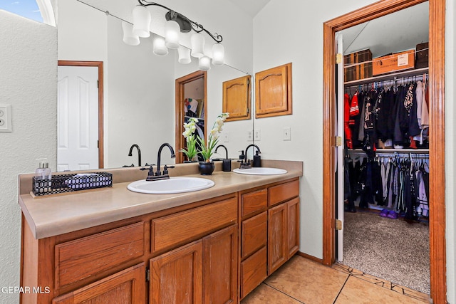 1328 Morgan Marie St, El Paso, TX 79936 - full bath featuring double vanity, tile patterned flooring, and a walk in closet