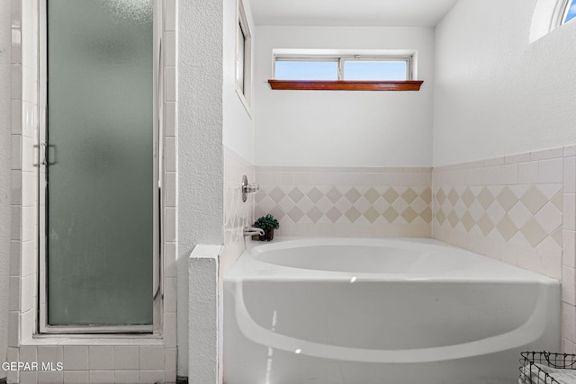 1328 Morgan Marie St, El Paso, TX 79936 - bathroom with a garden tub, a shower stall, and a textured wall