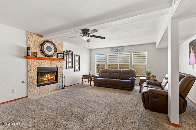 1328 Morgan Marie St, El Paso, TX 79936 - living area with carpet flooring, a stone fireplace, a ceiling fan, and a textured ceiling