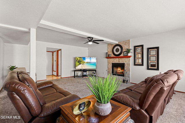 1328 Morgan Marie St, El Paso, TX 79936 - carpeted living area featuring a ceiling fan, baseboards, a tiled fireplace, and beam ceiling