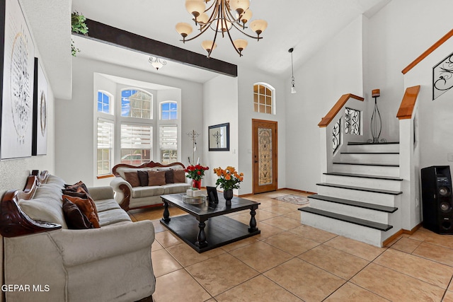 1328 Morgan Marie St, El Paso, TX 79936 - living room with a chandelier, a towering ceiling, stairway, light tile patterned flooring, and baseboards