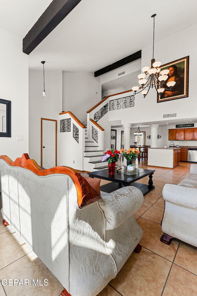 1328 Morgan Marie St, El Paso, TX 79936 - living room with a chandelier, light tile patterned flooring, beam ceiling, stairway, and high vaulted ceiling