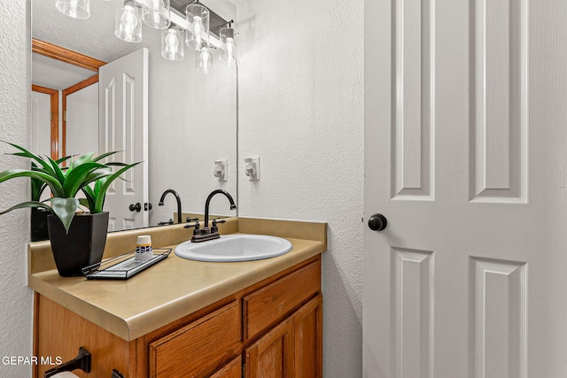 1328 Morgan Marie St, El Paso, TX 79936 - bathroom featuring a textured wall and vanity