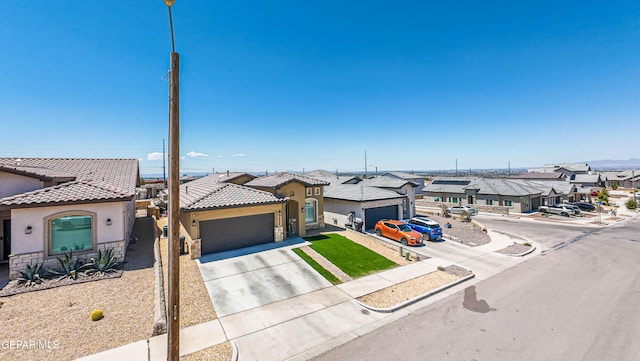 12826 Osmotherly Ave, El Paso, TX 79928 - view of front of house with a residential view, stucco siding, a garage, a tile roof, and concrete driveway