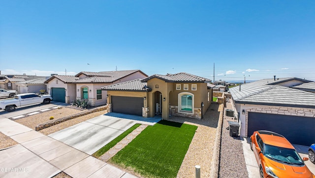 12826 Osmotherly Ave, El Paso, TX 79928 - mediterranean / spanish home with stucco siding, a garage, concrete driveway, a tiled roof, and stone siding