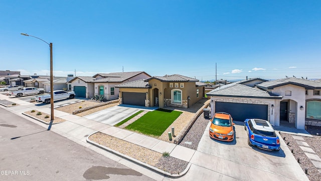 12826 Osmotherly Ave, El Paso, TX 79928 - mediterranean / spanish home featuring driveway, an attached garage, stucco siding, and a tiled roof