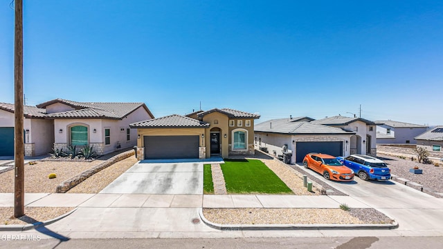 12826 Osmotherly Ave, El Paso, TX 79928 - mediterranean / spanish-style house with a garage, concrete driveway, stucco siding, stone siding, and a tiled roof