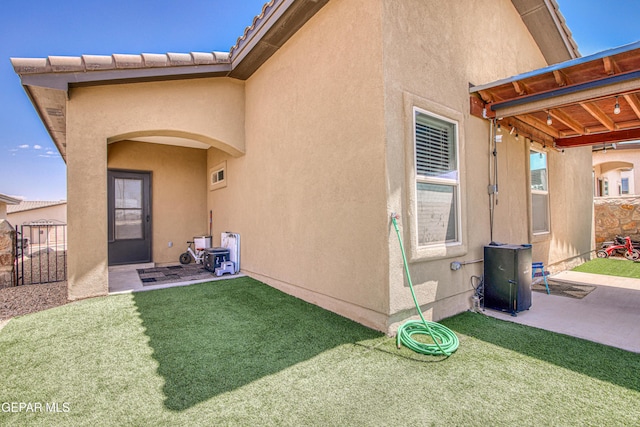 12826 Osmotherly Ave, El Paso, TX 79928 - doorway to property with stucco siding and a patio area